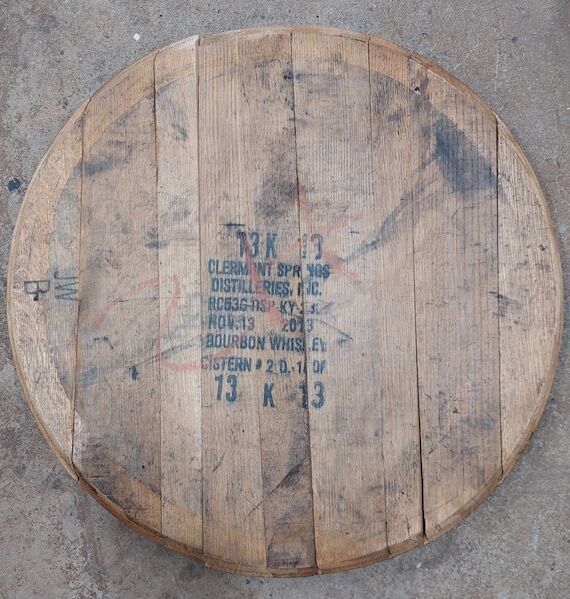 Cleaned barrel heads, unfinished whiskey tops...