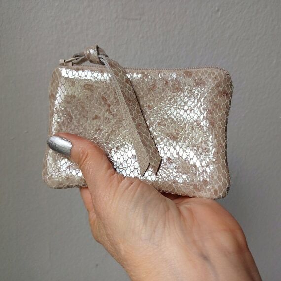 Platinum snake leather pouches in 3 sizes, mi...