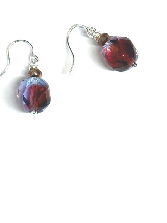 Mystical glass bead earrings catch the light ...