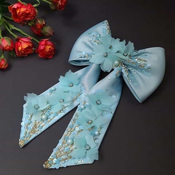 Teal hair bow with flowers Embellished hair b...