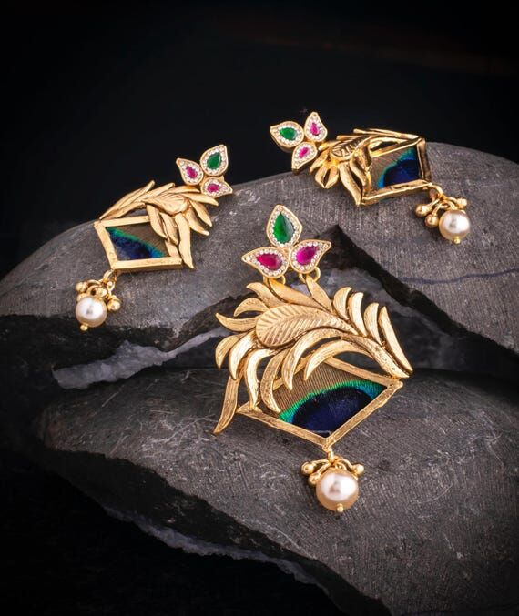 Jadau kundan with peacock feather pendant set...