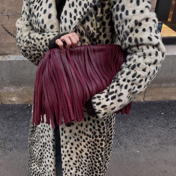 Burgundy genuine leather fringed framed clutc...