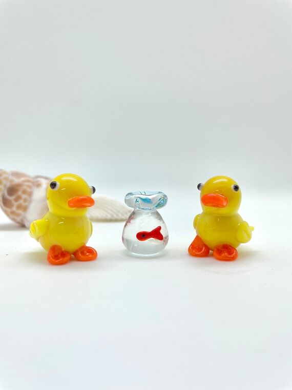 Handmade blown glass small figurine yellow du...