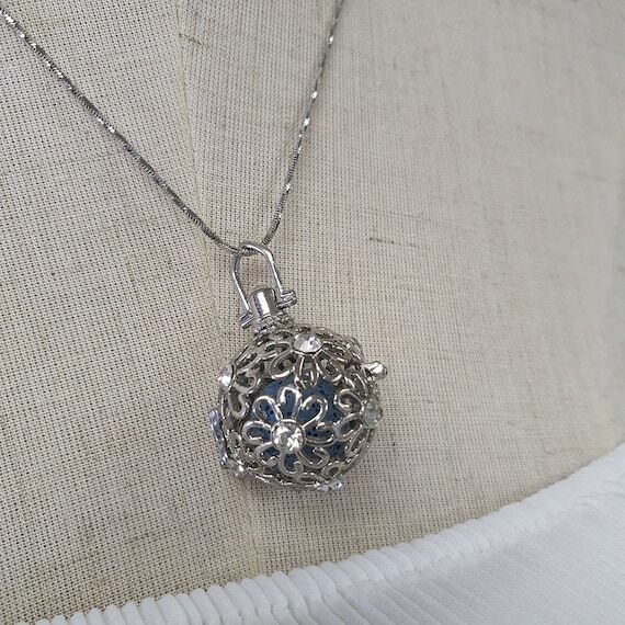 Floral Aroma Diffuser Necklace: Silver Plated...