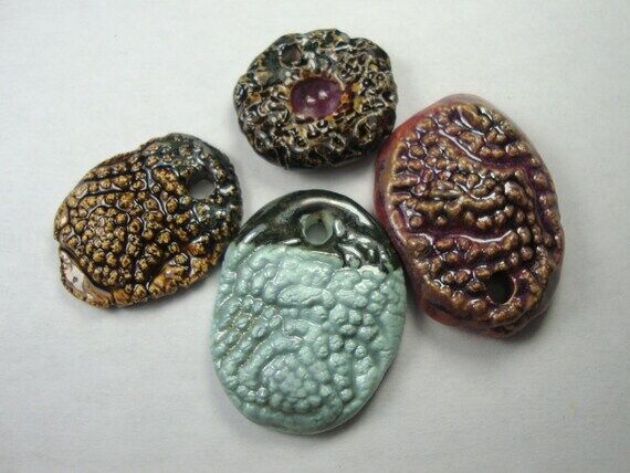Set of 4 handmade porcelain pendants beads. C...