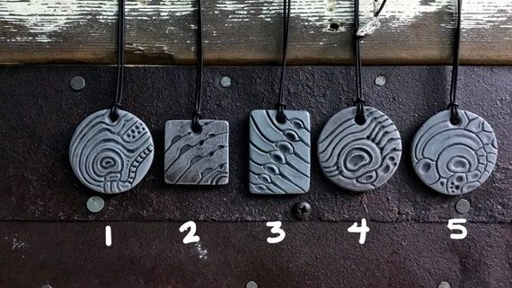 Handmade Ceramic bio organic/biomech necklace...