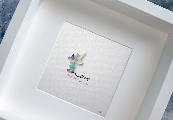 Handmade unicorn wall art crafted from natura...