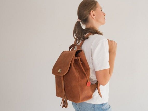 Tassel drawstring backpack with twist lock ma...