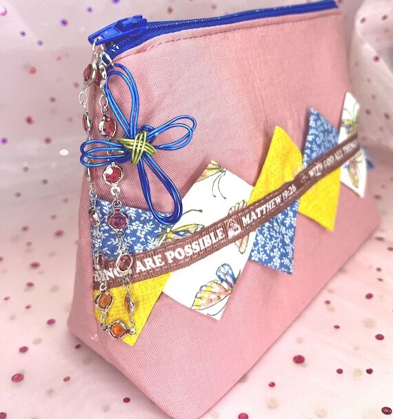 Pink canvas cosmetic bag with Bible scripture...