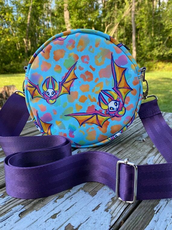 Halloween Spooky Neon Bat Round Crossbody Bag...
