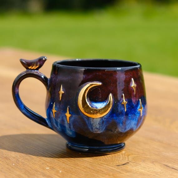 Handmade coffee mug night style with golden s...