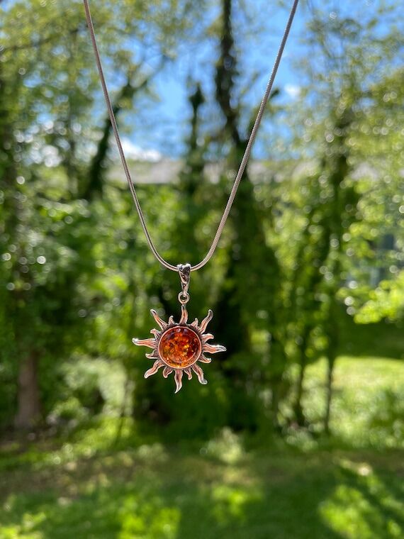 Sun pendant. Baltic amber sun pendant, Sterli...