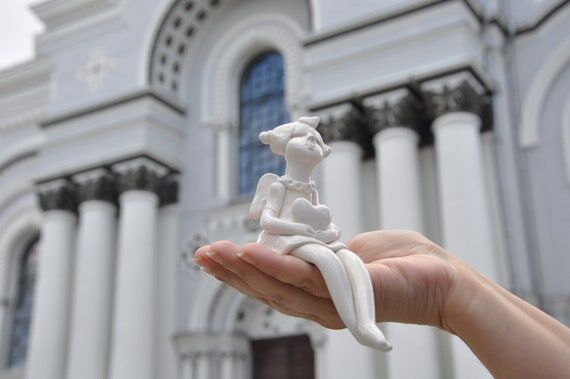 Angel Girl with a heart - Fairy Sitting on s...