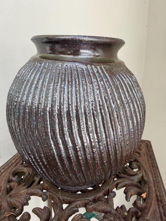 Handmade ceramic vase, faceted and altered to...