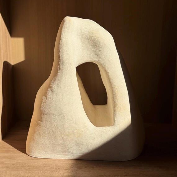 Beige Asymmetrical Ceramic Sculpture: Handbui...