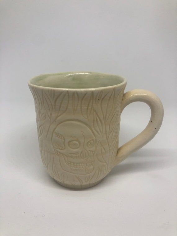 Handmade Ceramic Mug with Skull and Leaf Engr...